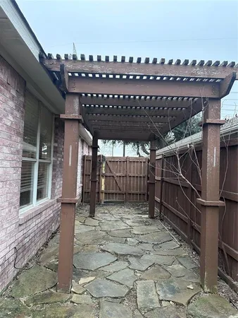 a view of a roof deck with a barbeque grill and a wooden floor