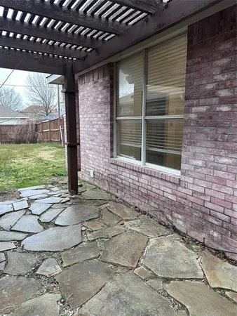 a view of house with backyard and garden