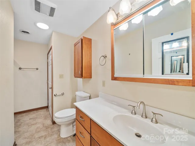 a bathroom with a glass shower door