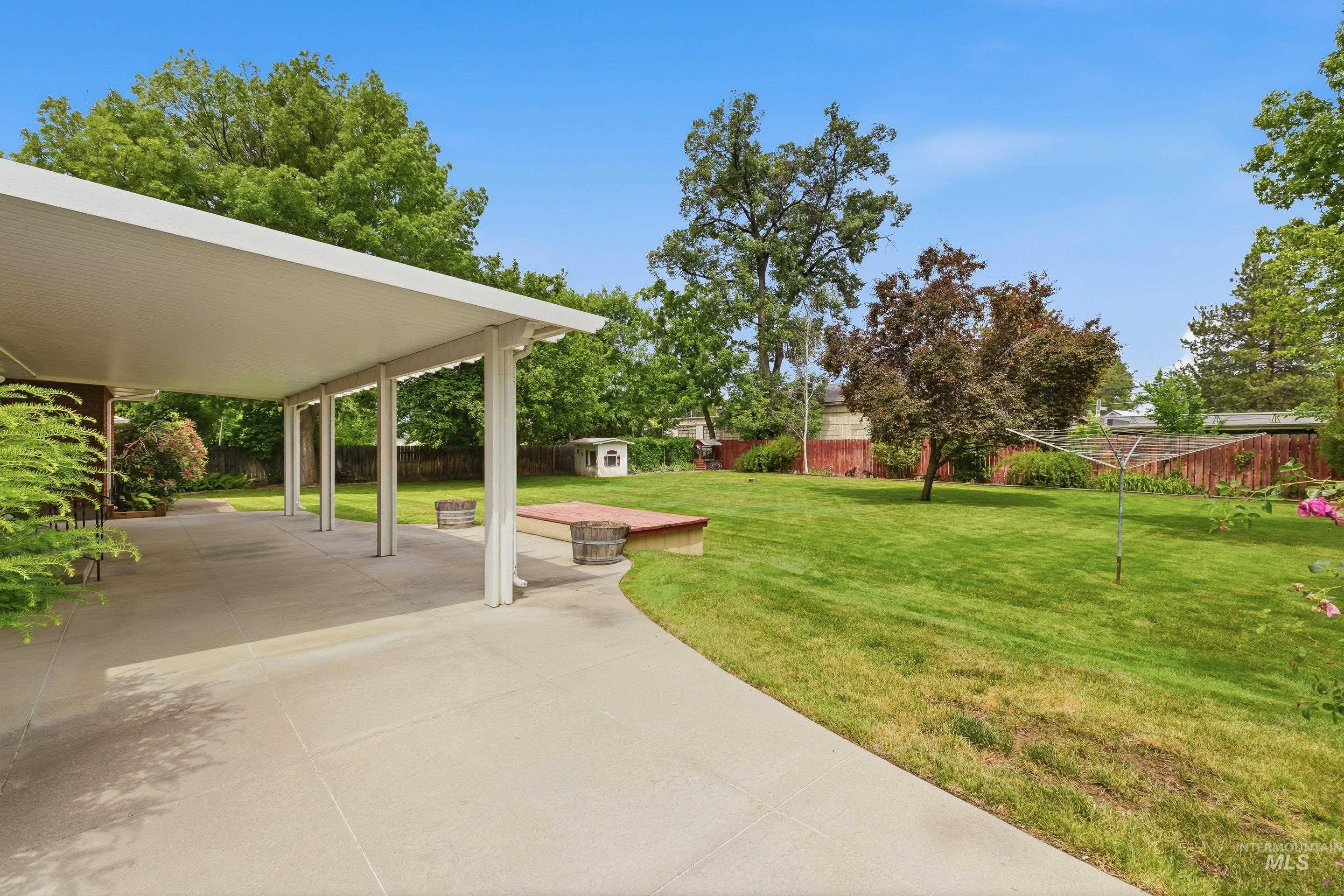 504 West Howe Street Boise, ID 83706 - Photo 41 of 47 Expansive concrete patio with a white covered awning, offering generous outdoor living space