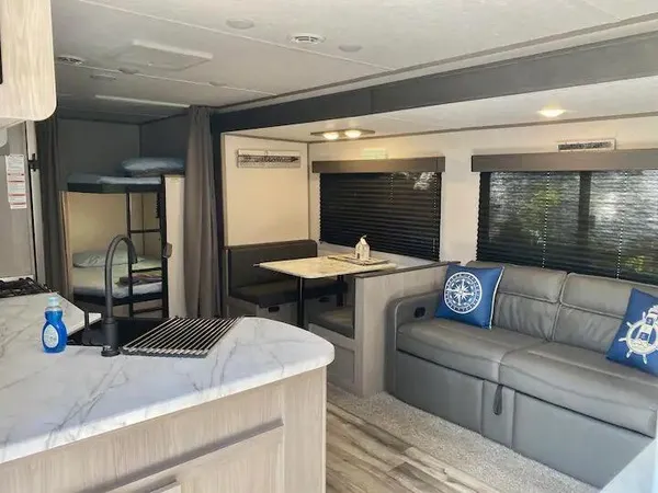 a living room with furniture and a table