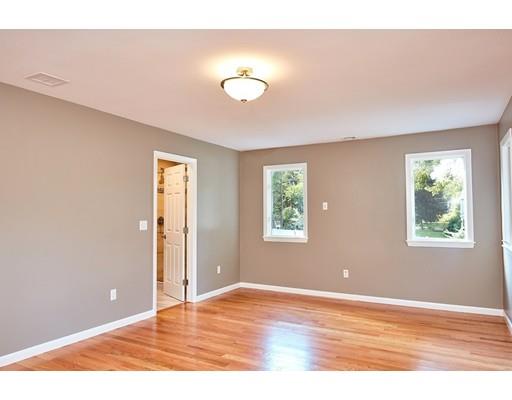17 Rustic Lane Reading, MA 01867 - Photo 15 of 40 a view of an empty room with wooden floor and a window
