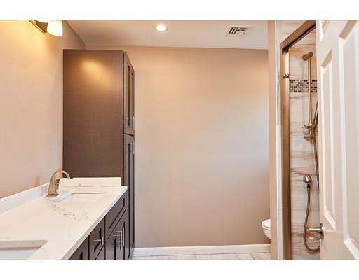 17 Rustic Lane Reading, MA 01867 - Photo 18 of 40 a bathroom with a sink and a mirror
