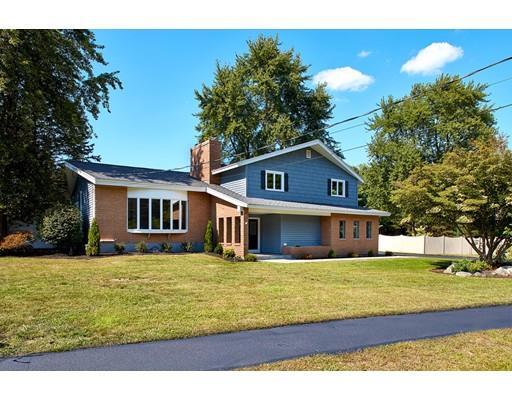 17 Rustic Lane Reading, MA 01867 - Photo 2 of 40 a house view with a garden space