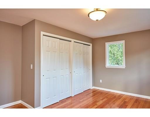 17 Rustic Lane Reading, MA 01867 - Photo 21 of 40 a view of an empty room with window and closet area