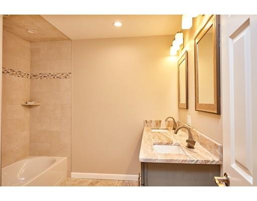 17 Rustic Lane Reading, MA 01867 - Photo 27 of 40 a bathroom with a sink and a mirror