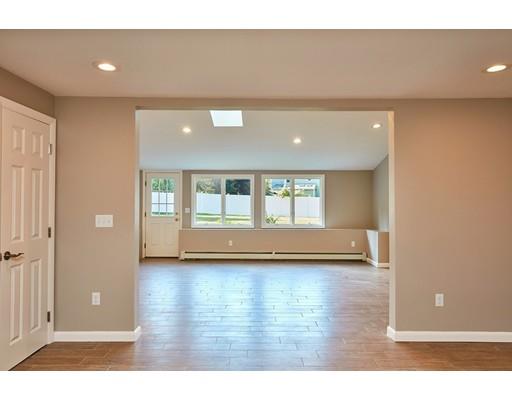 17 Rustic Lane Reading, MA 01867 - Photo 29 of 40 a view of empty room with wooden floor and fan