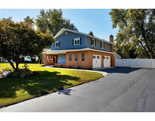 17 Rustic Lane Reading, MA 01867 - Photo 3 of 40 a front view of a house with a yard