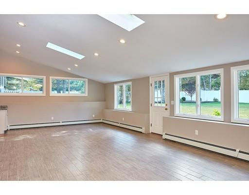 17 Rustic Lane Reading, MA 01867 - Photo 32 of 40 an empty room with wooden floor and windows
