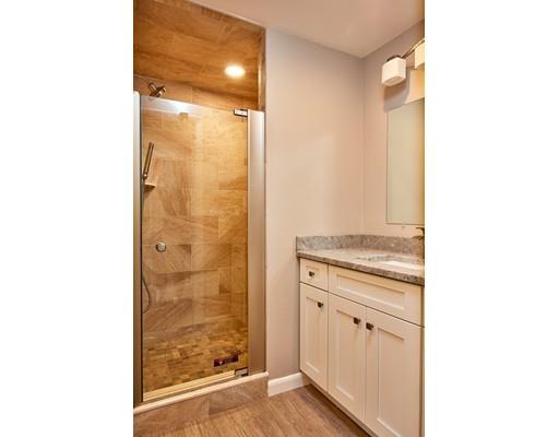 17 Rustic Lane Reading, MA 01867 - Photo 33 of 40 a bathroom with a shower and a sink