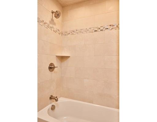 17 Rustic Lane Reading, MA 01867 - Photo 34 of 40 a bathroom with a bathtub and shower