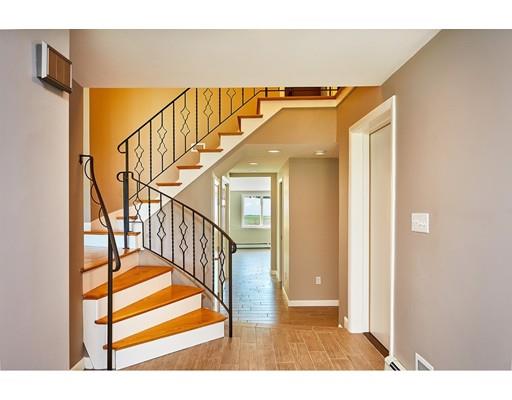 17 Rustic Lane Reading, MA 01867 - Photo 5 of 40 a view of entryway and hall with wooden floor