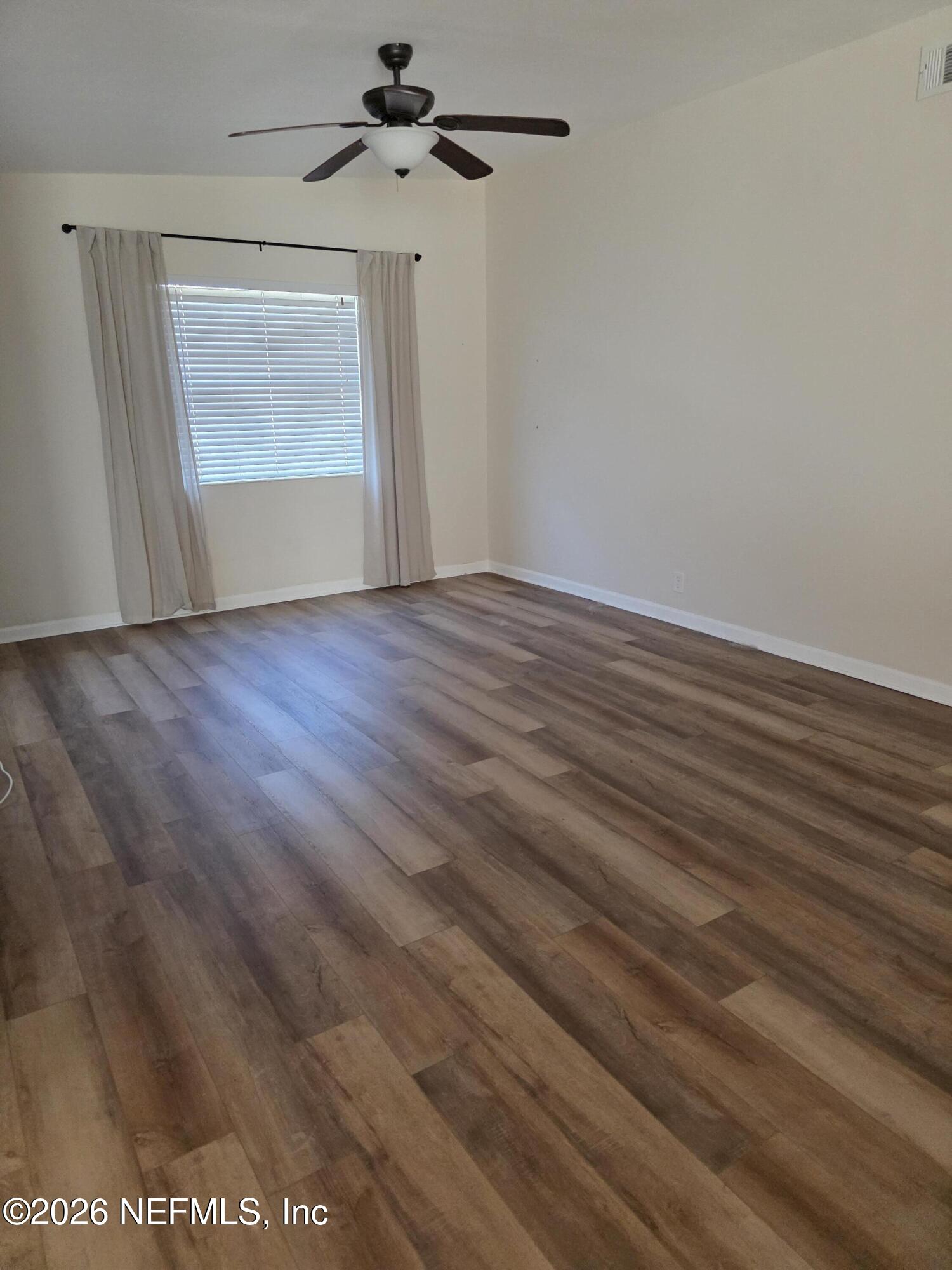 3616 Toledo Road Jacksonville, FL 32217 - Photo 11 of 34 wooden floor in an empty room
