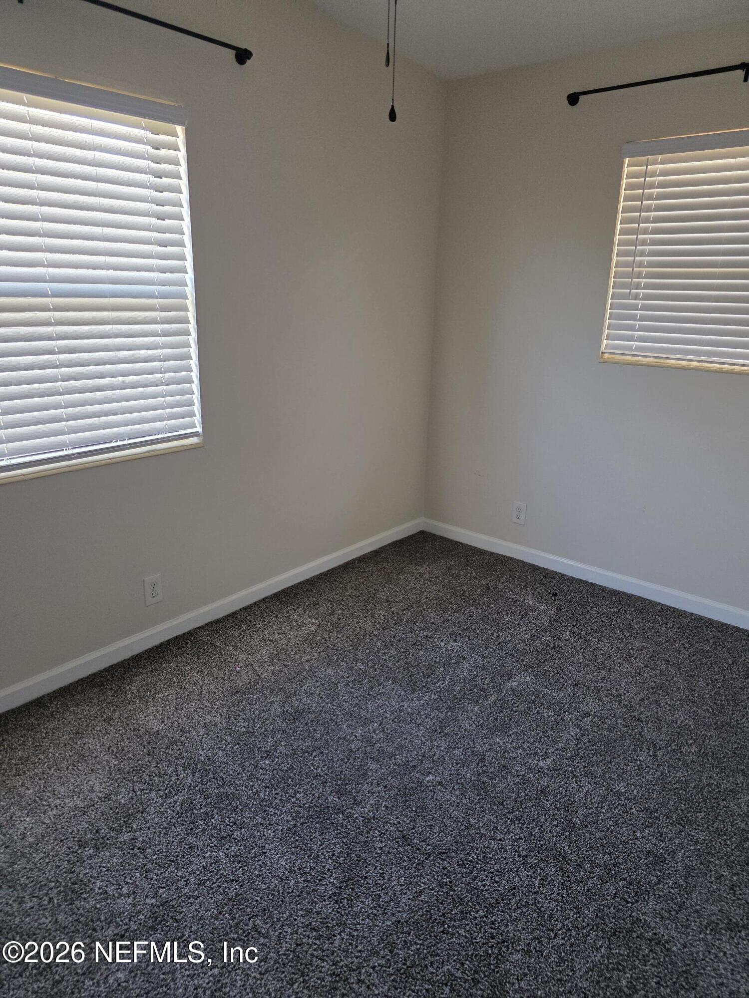 3616 Toledo Road Jacksonville, FL 32217 - Photo 14 of 34 an empty room with a window