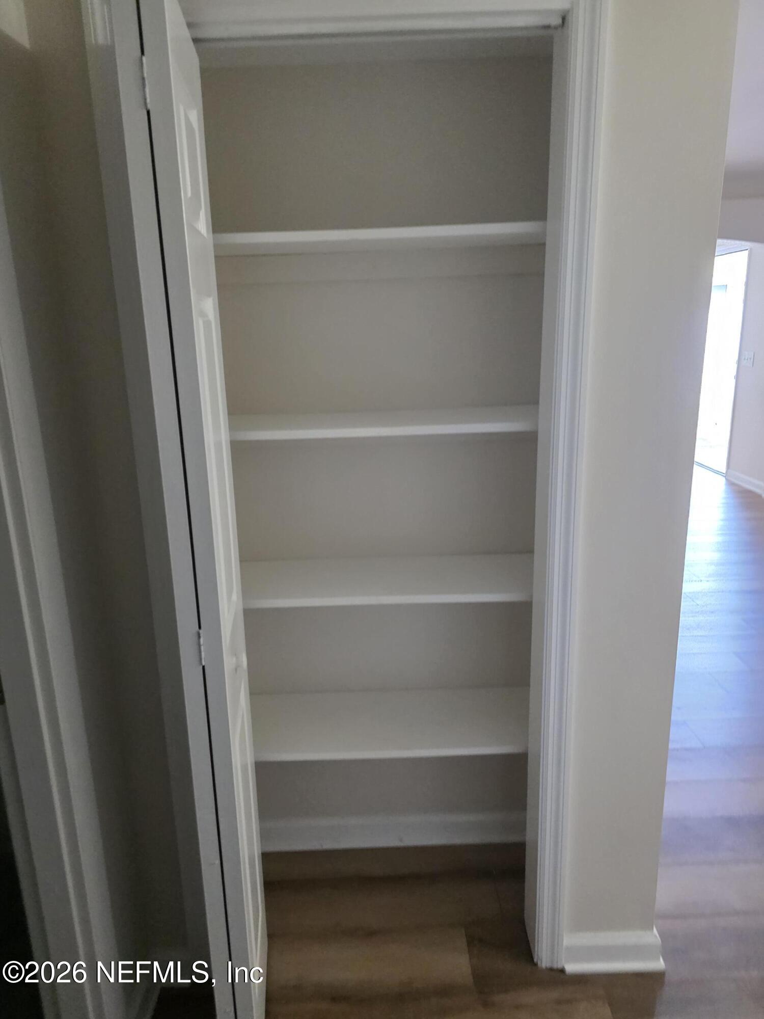 3616 Toledo Road Jacksonville, FL 32217 - Photo 22 of 34 a view of walk in closet with empty racks