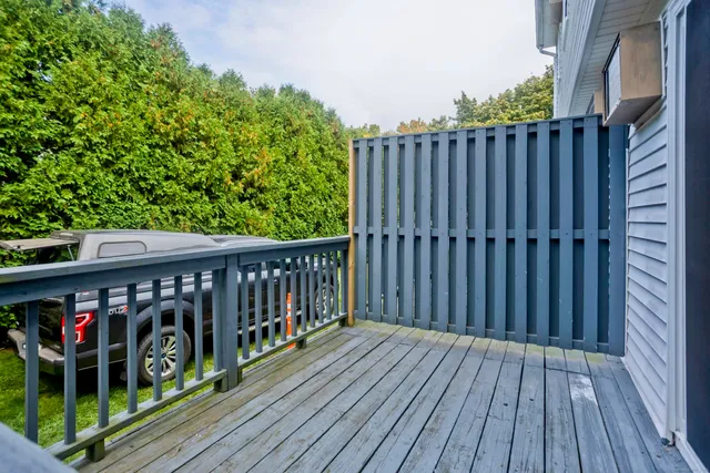 a view of a pathway with a wrought fence