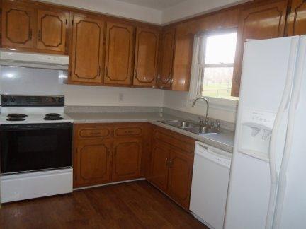 The step-saver kitchen keeps everything within easy reach, but still has a nice amount of cabinet space.  All of the kitchen appliances remain!