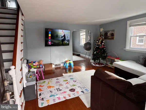 a living room with furniture and a flat screen tv