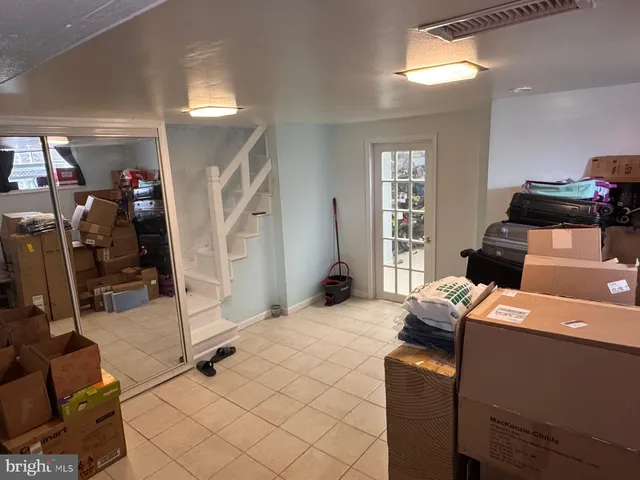 a bedroom with furniture and natural light