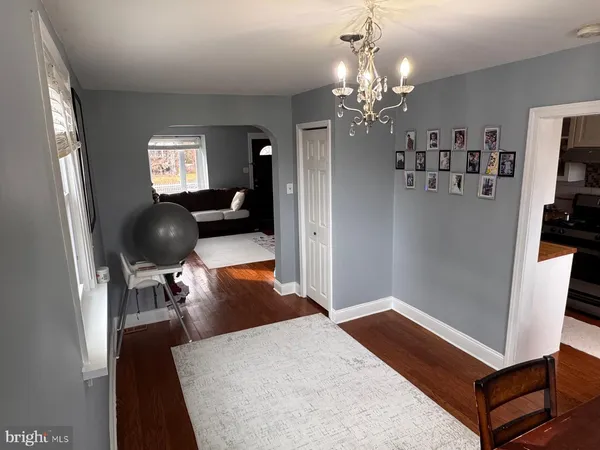 a bedroom with furniture and a chandelier