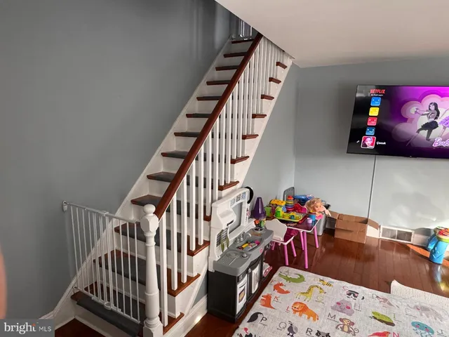 a view of a bedroom with baby crib