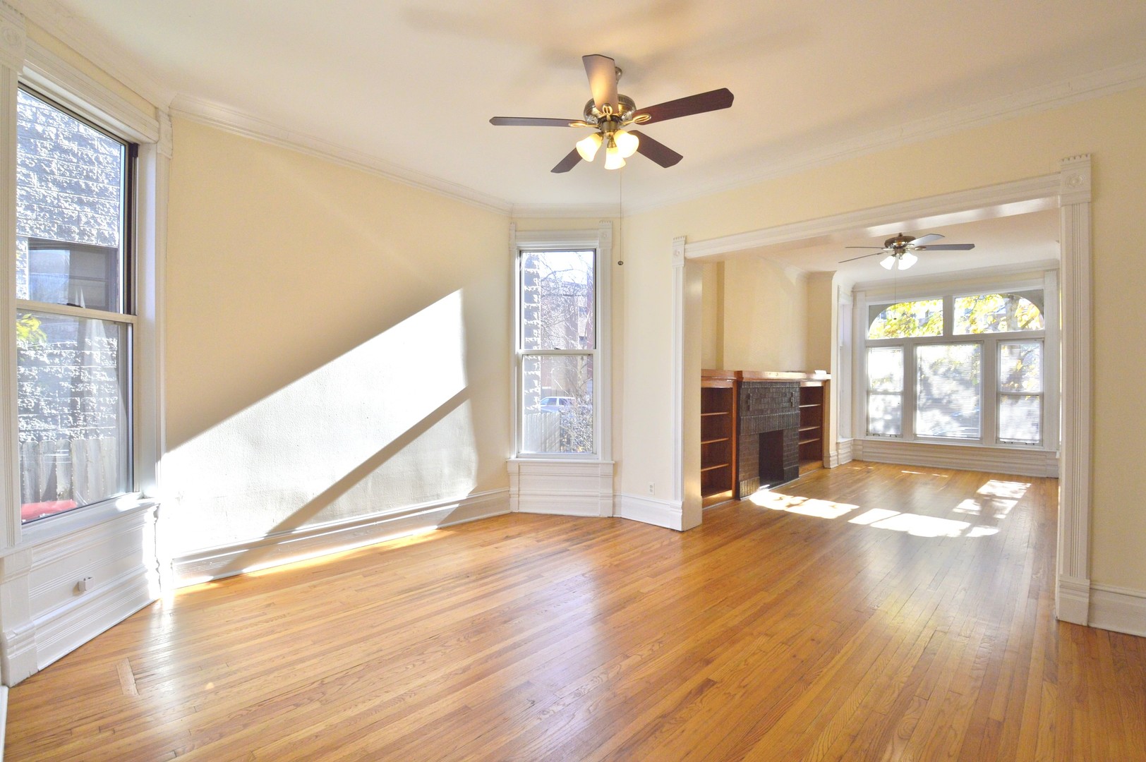 1924 West Crystal Street, Unit 3 Chicago, IL 60622 - Photo 3 of 13 a view of an empty room with window and wooden floor