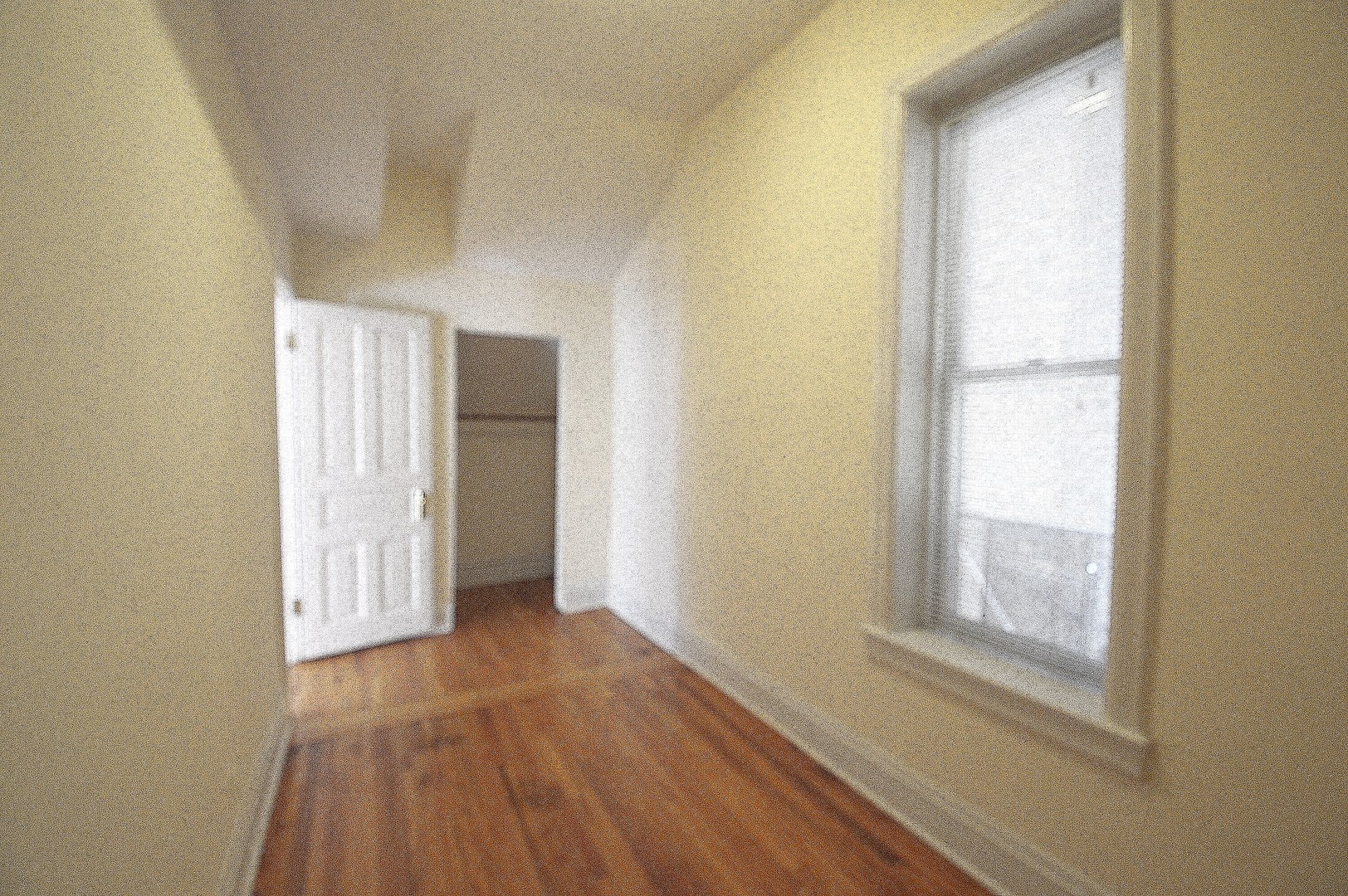 1924 West Crystal Street, Unit 3 Chicago, IL 60622 - Photo 6 of 13 a view of an empty room with wooden floor and a window