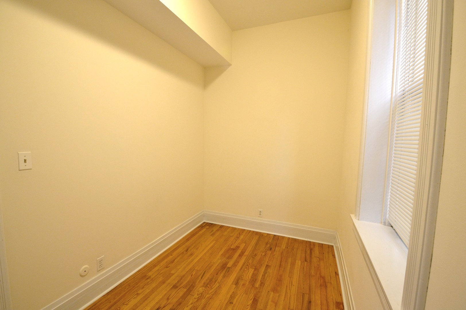 1924 West Crystal Street, Unit 3 Chicago, IL 60622 - Photo 9 of 13 a view of a small space with wooden floor and a window