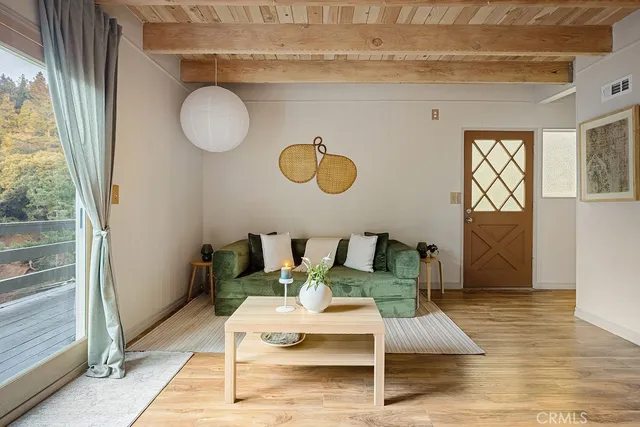 a view of a livingroom with furniture and wooden floor