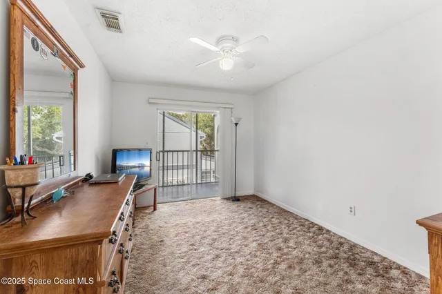 a view of a livingroom with furniture and a window
