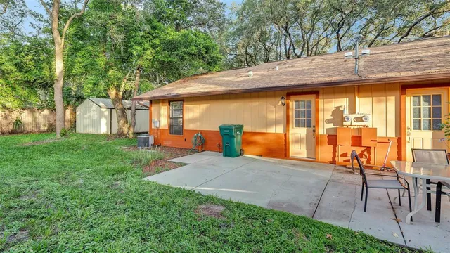 a view of backyard with patio