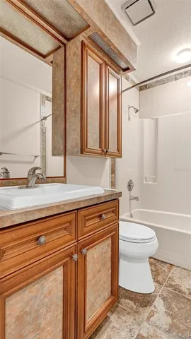a bathroom with a sink a toilet and a bathtub