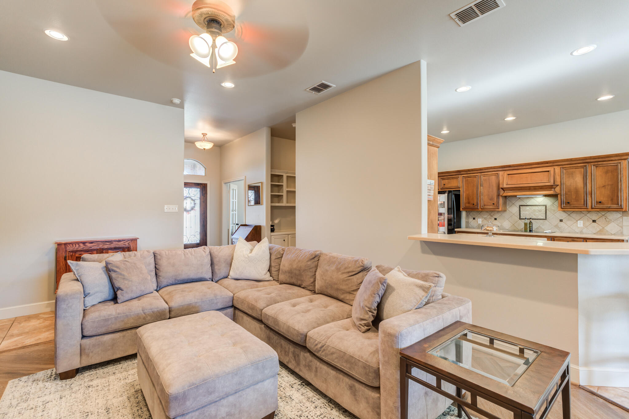 4707 106th Street Lubbock, TX 79424 - Photo 11 of 51 a living room with furniture and a large window