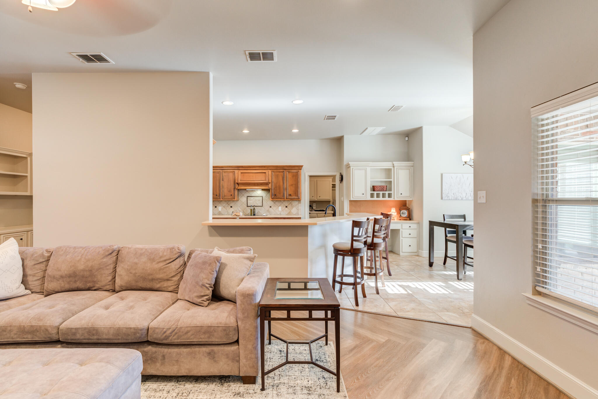 4707 106th Street Lubbock, TX 79424 - Photo 12 of 51 a living room with furniture and kitchen view