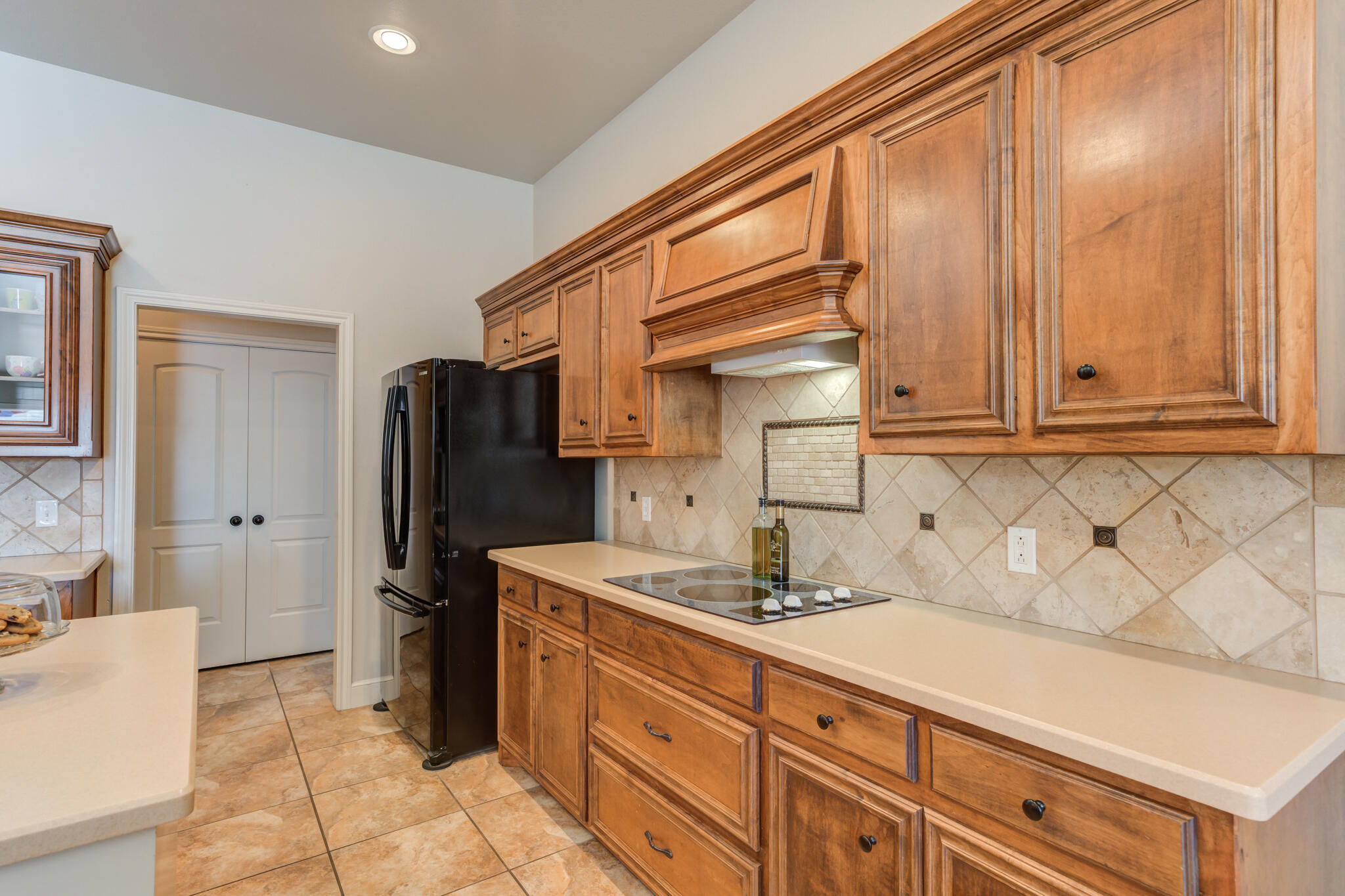 4707 106th Street Lubbock, TX 79424 - Photo 18 of 51 a kitchen with stainless steel appliances granite countertop a refrigerator and a sink