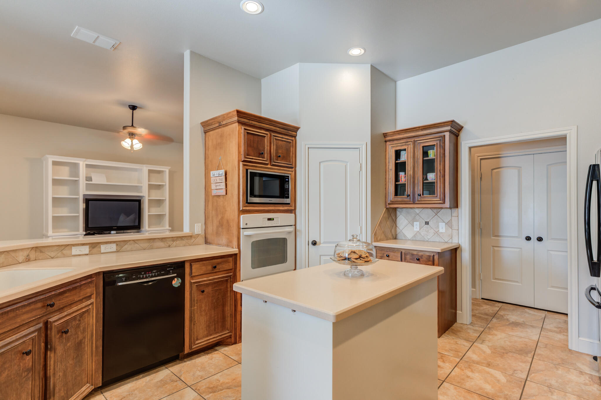 4707 106th Street Lubbock, TX 79424 - Photo 20 of 51 a kitchen with a sink stove and microwave