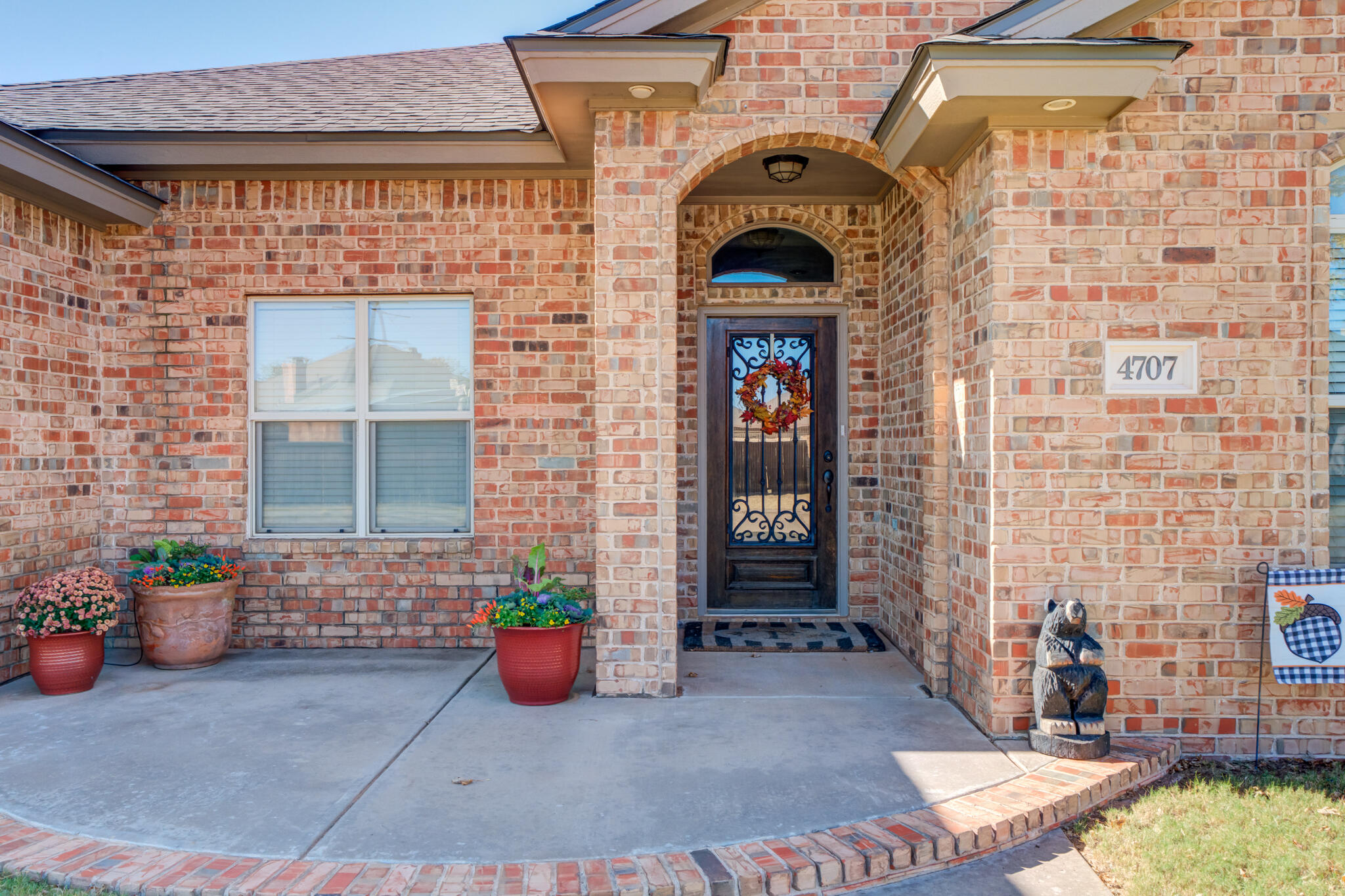 4707 106th Street Lubbock, TX 79424 - Photo 2 of 51 a front view of a house with outdoor seating