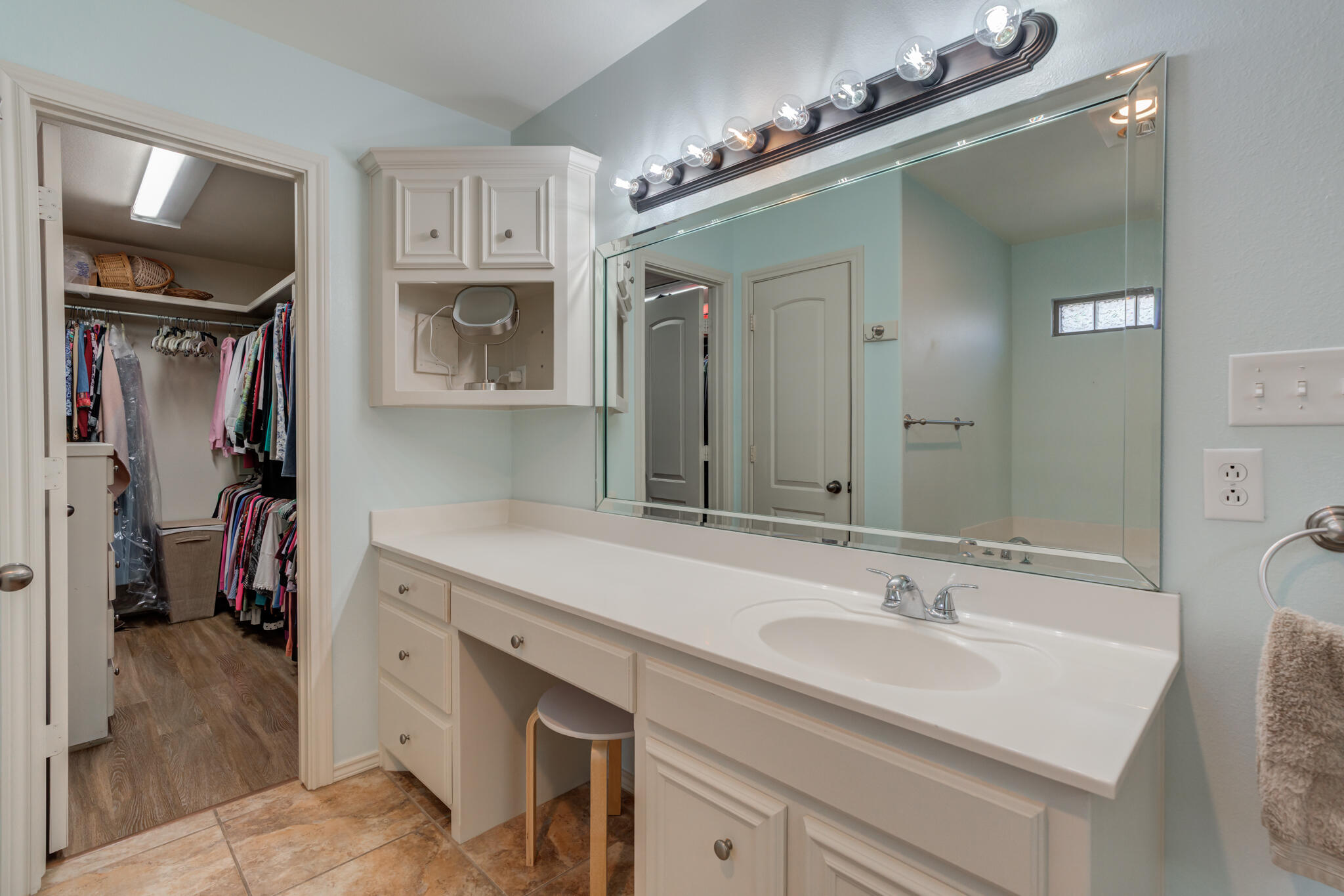 4707 106th Street Lubbock, TX 79424 - Photo 32 of 51 a bathroom with a sink double vanity and a mirror