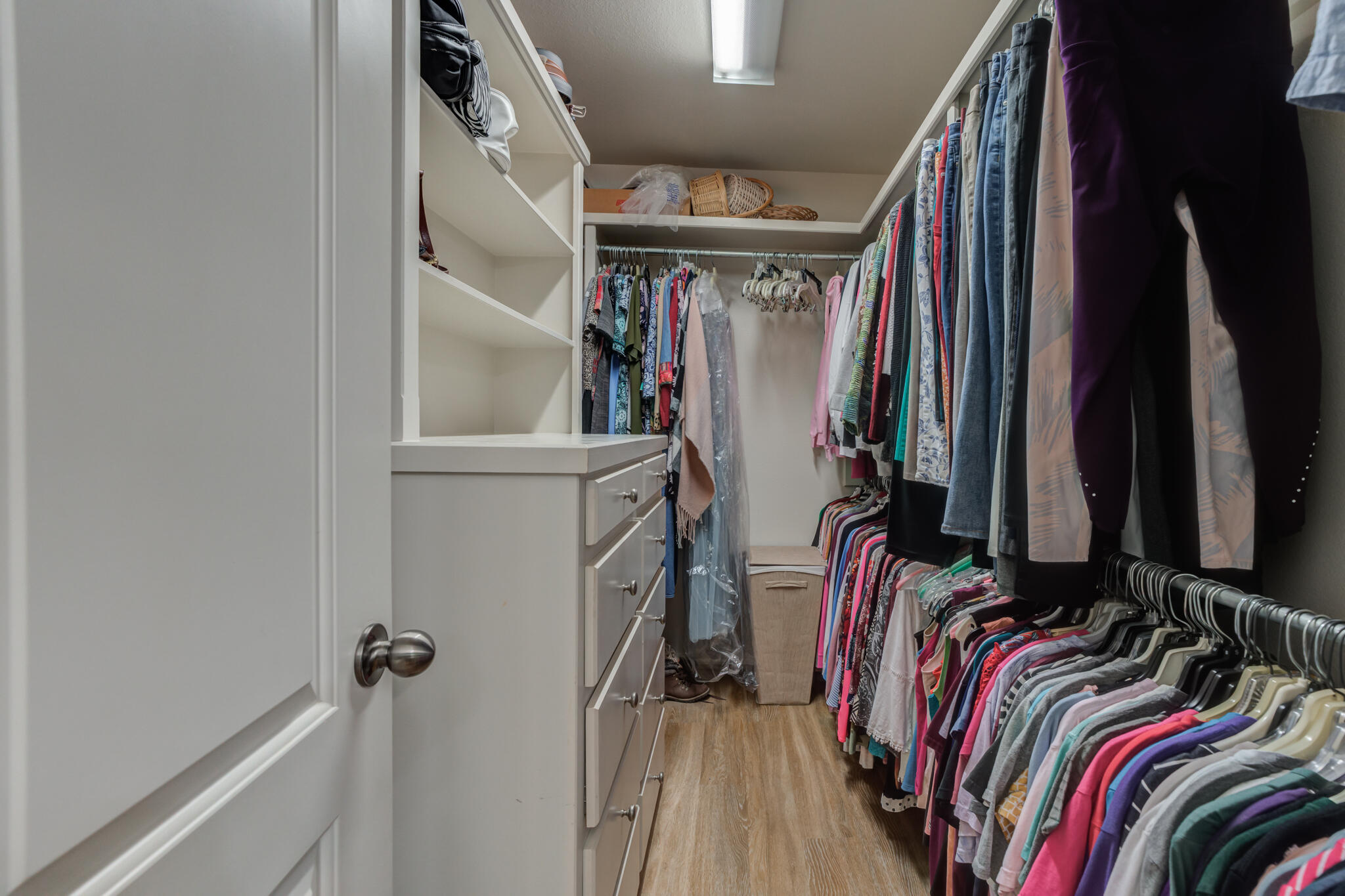 4707 106th Street Lubbock, TX 79424 - Photo 33 of 51 a view of walk in closet with clothes and shoes
