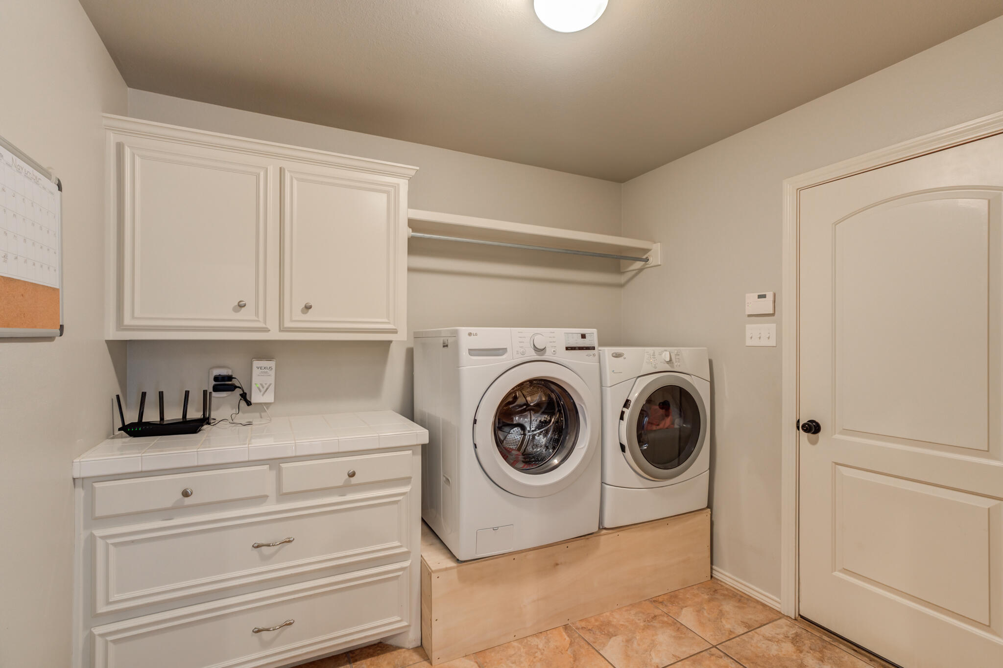 4707 106th Street Lubbock, TX 79424 - Photo 44 of 51 a utility room with dryer and washer