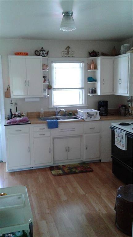 629 East State Avenue High Point, NC 27262 - Photo 9 of 26 View of kitchen from living room. Butcher block counter top