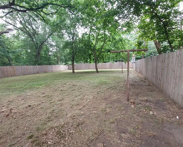 a backyard of a house with trees