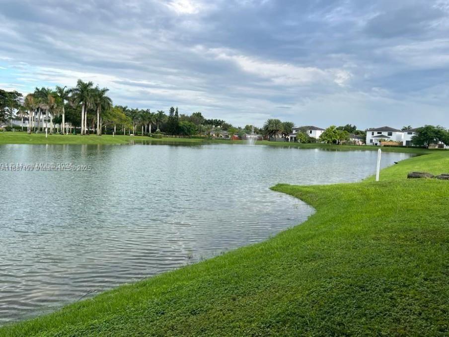205 Southeast 29th Terrace, Unit 5 Homestead, FL 33033 - Photo 17 of 17 a view of a lake from a yard