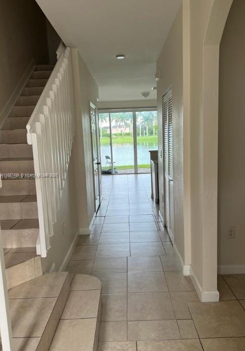 205 Southeast 29th Terrace, Unit 5 Homestead, FL 33033 - Photo 2 of 17 a view of a hallway with windows