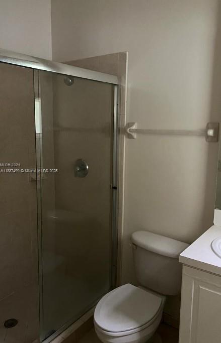 205 Southeast 29th Terrace, Unit 5 Homestead, FL 33033 - Photo 8 of 17 a white toilet sitting next to a shower