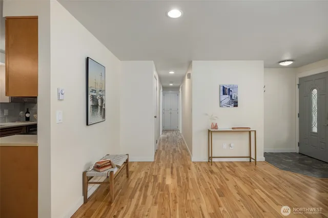 a view of a room with wooden floor and cabinet