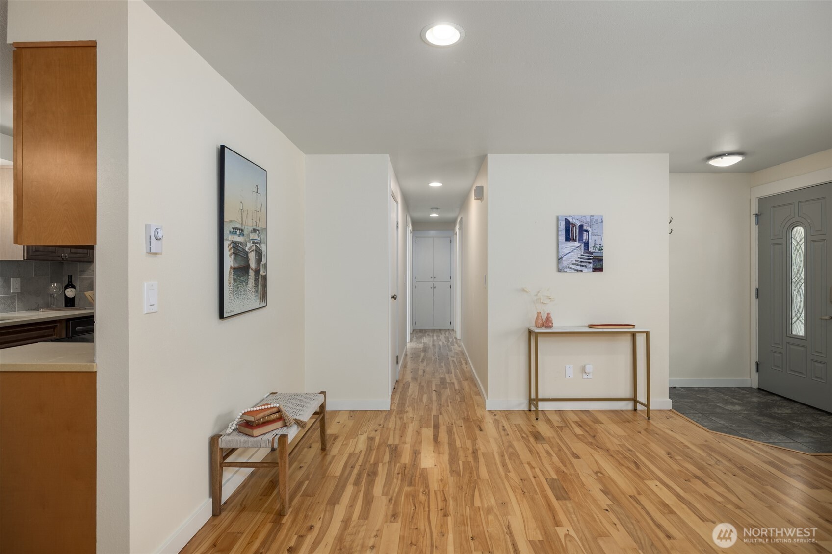 611 Whatcom Street La Conner, WA 98257 - Photo 14 of 26 a view of a room with wooden floor and cabinet