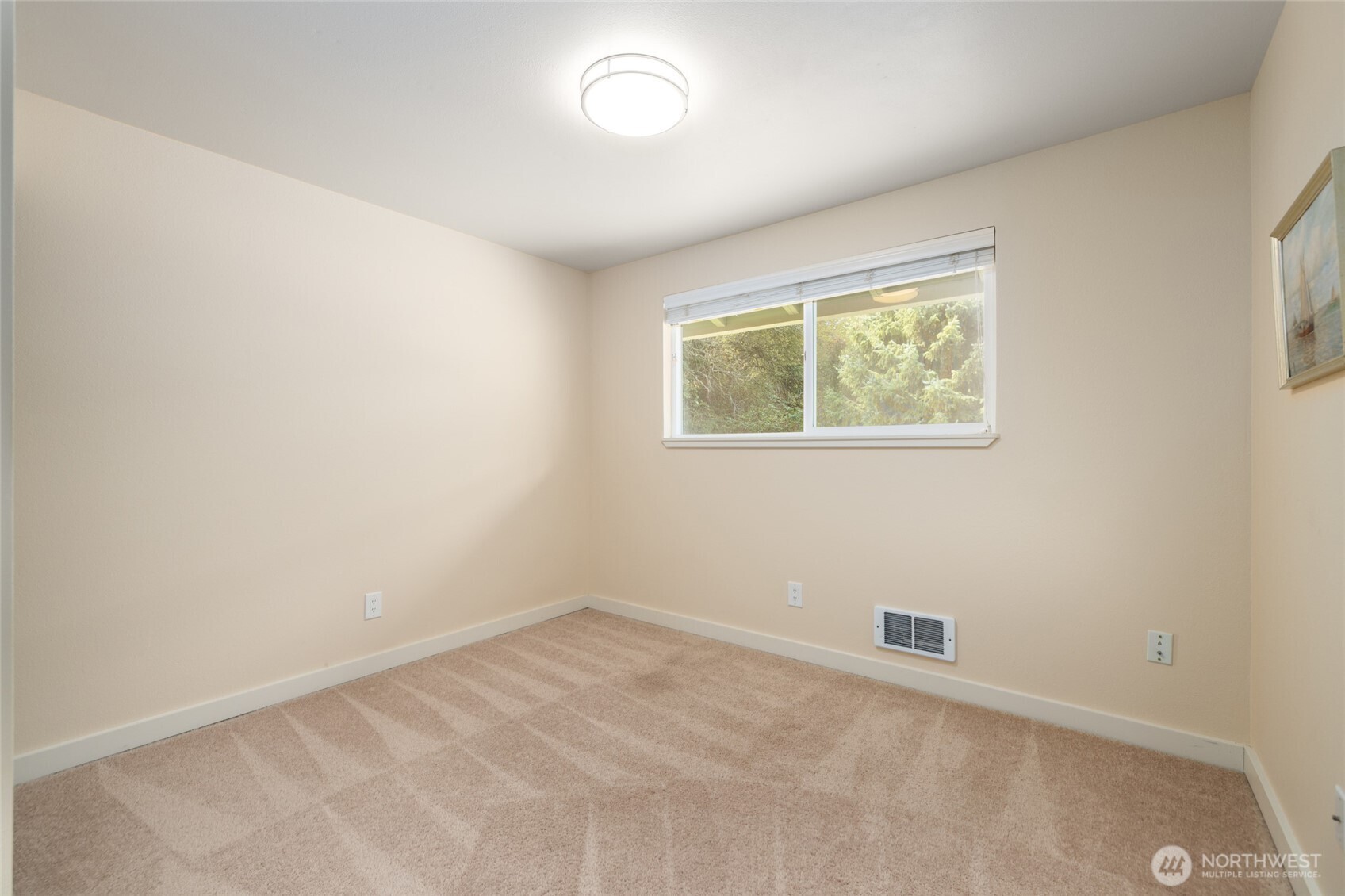 611 Whatcom Street La Conner, WA 98257 - Photo 17 of 26 an empty room with a window