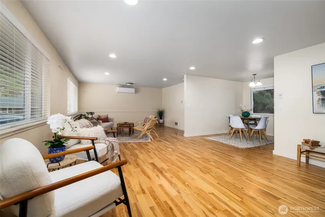a view of a dining room with furniture and a large window