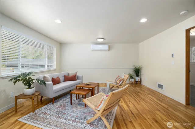 a living room with furniture and a rug